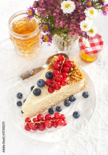 Piece of homemade honey cake with fresh berries