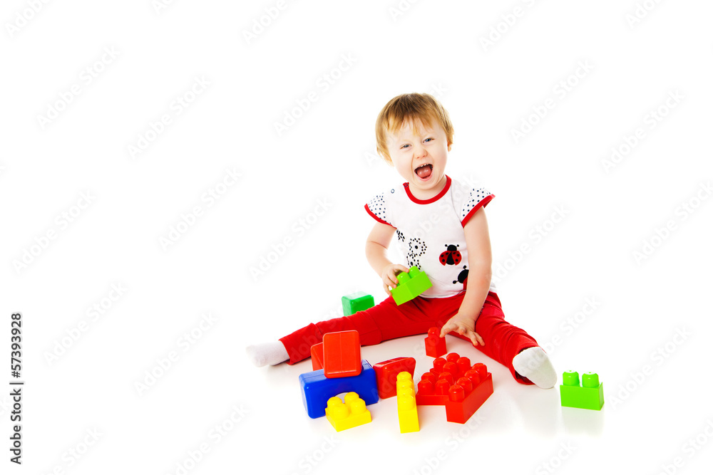 baby girl is playing with educational toys