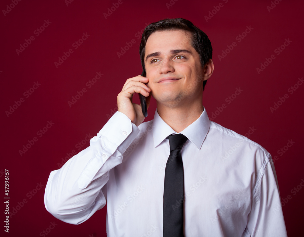 Man with mobilephone on red background Man with mobilephone on red background