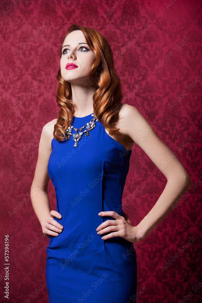 Redhead women at red background