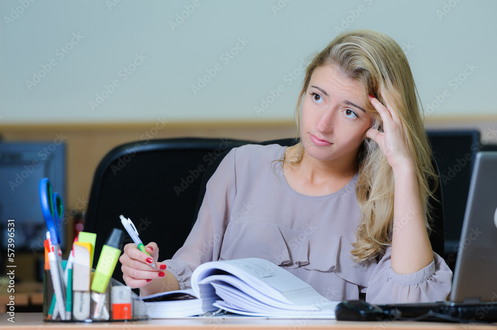 Fototapeta premium Tired businesswoman at the office