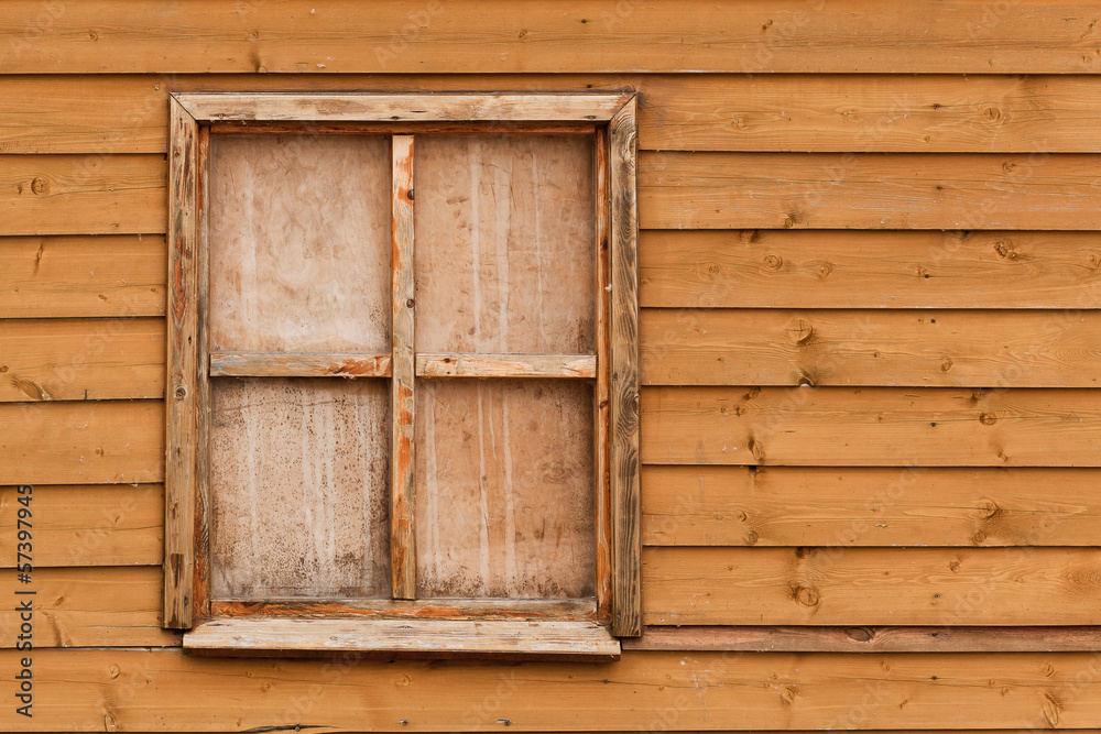 window in wooden wall