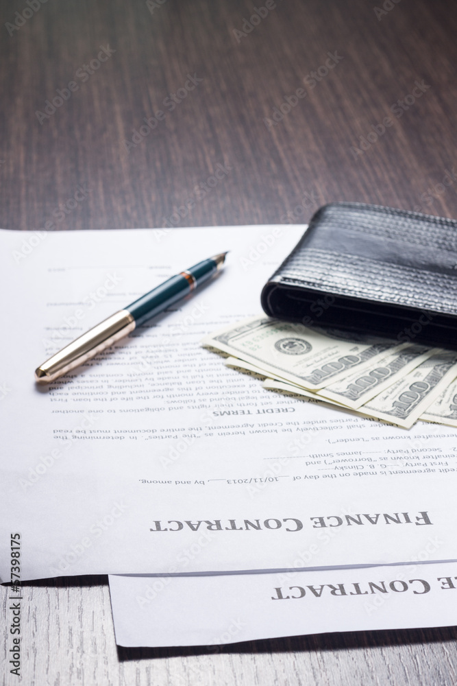 Financial document with wallet, money and fountain pen