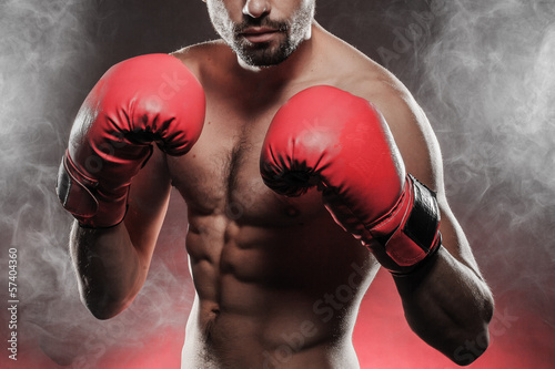 mens torso wearing boxing gloves © stryjek