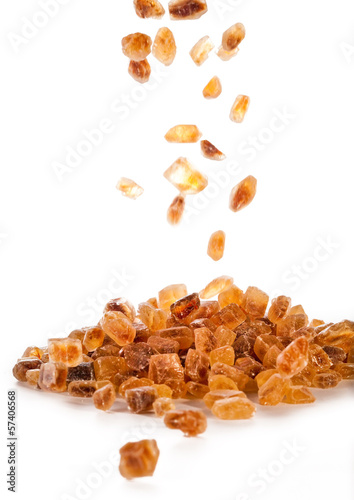 Slices of falling brown candy sugar ..