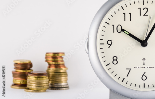 time is money with standing clock and euro's