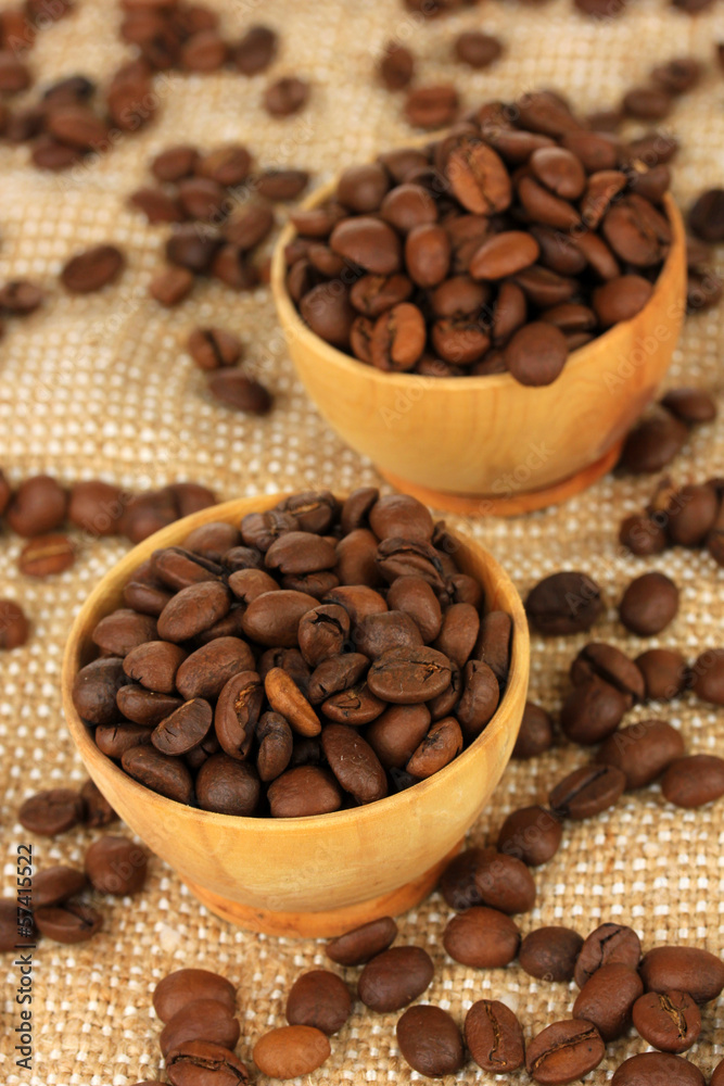 Coffee beans in bowls on table close-up Coffee beans in bowls on table close-up