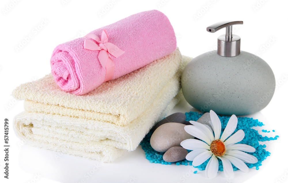 Beautiful spa setting with flower isolated on white Beautiful spa setting with flower isolated on white