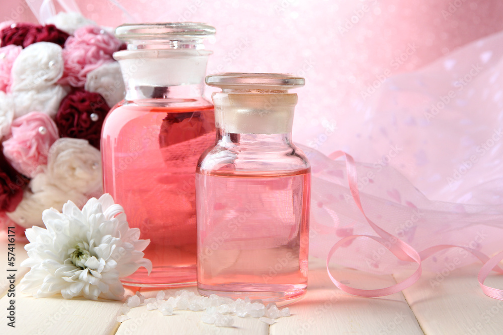 Glass bottles with color essence, on pink background Glass bottles with color essence, on pink background