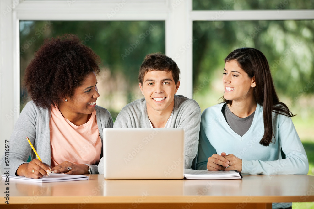 Happy Man With Laptop In Classroom