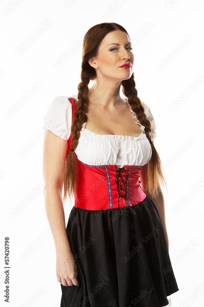 young and beautiful woman in a traditional Bavarian dress young and beautiful woman in a traditional Bavarian dress