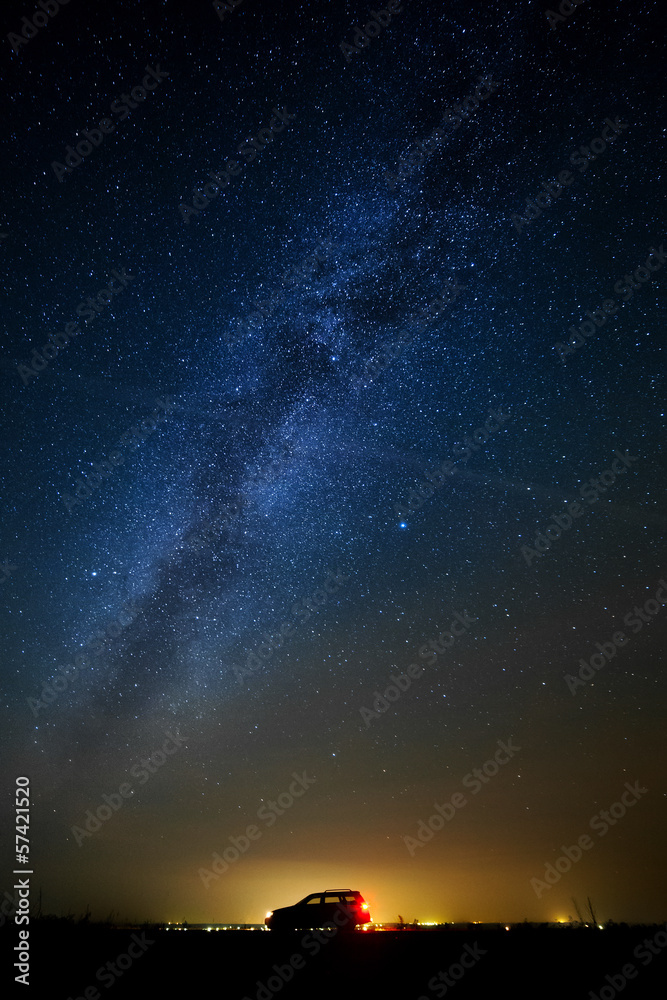 Fototapeta premium The car of the tourist against the star sky.