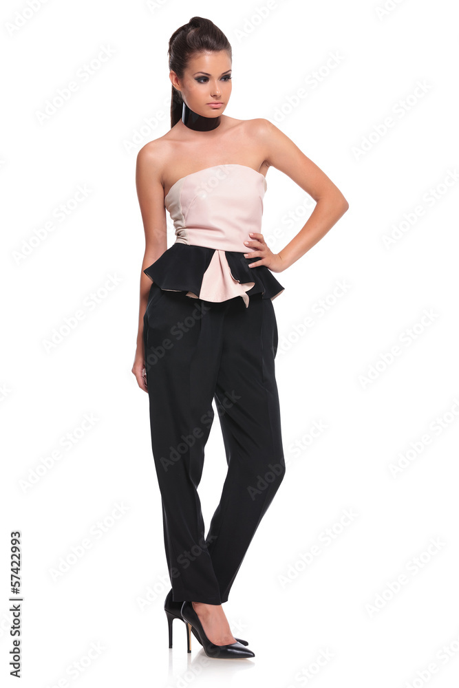 young woman with hand on hip is posing young woman with hand on hip is posing