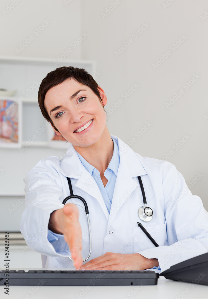 Female doctor giving her hand Female doctor giving her hand
