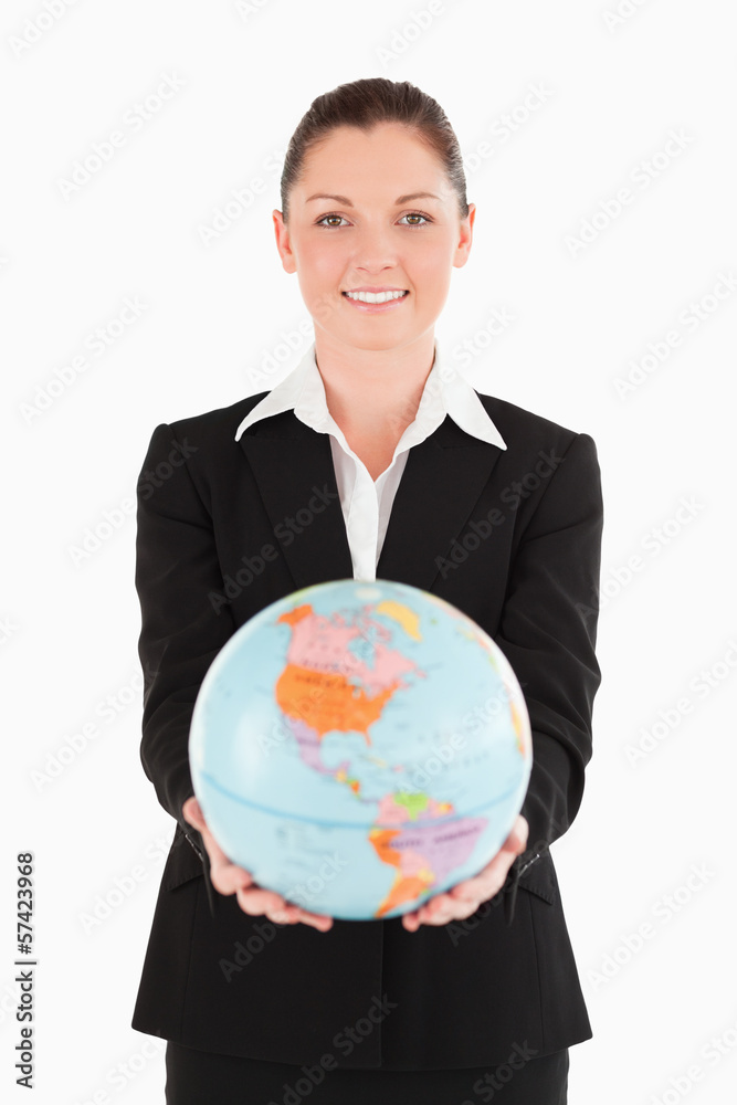 Pretty female in suit holding a globe Pretty female in suit holding a globe