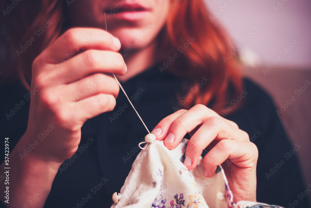 Close up on woman's hands sewing - obrazy, fototapety, plakaty 