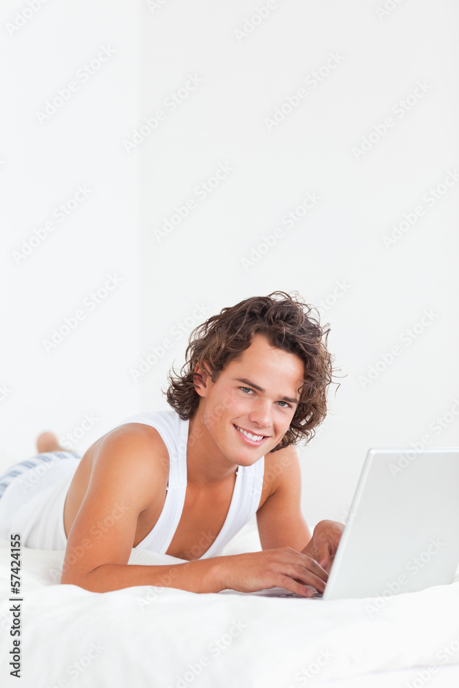 Portrait of a handsome man using a notebook Portrait of a handsome man using a notebook
