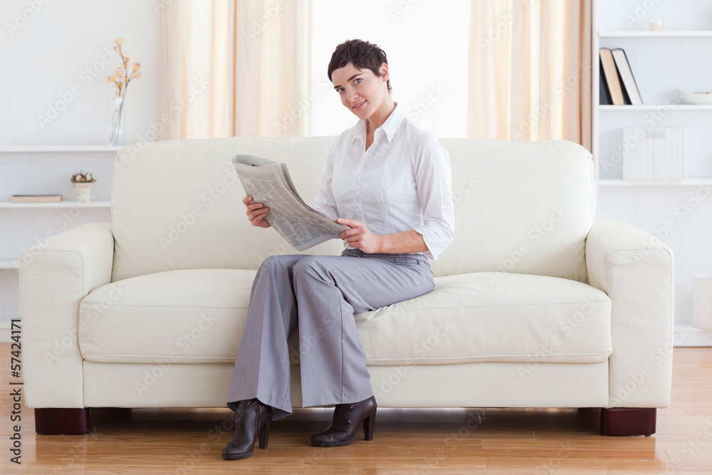Gorgeous brunette businesswoman reading the news Gorgeous brunette businesswoman reading the news