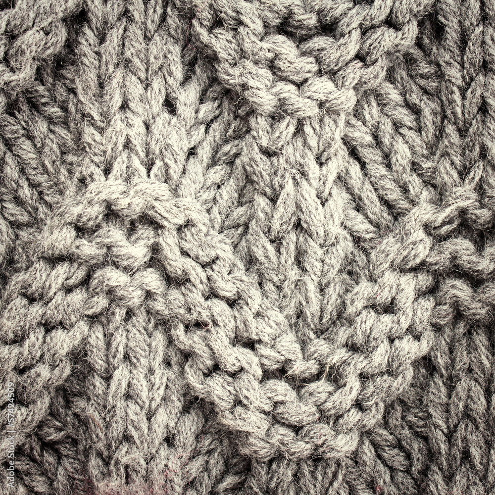 Grey knitting background texture, Knit woolen Christmas festiv Grey knitting background texture, Knit woolen Christmas festiv