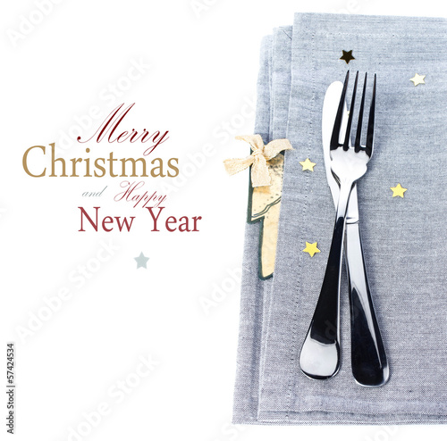 Christmas table place setting with christmas decorations in silv photo