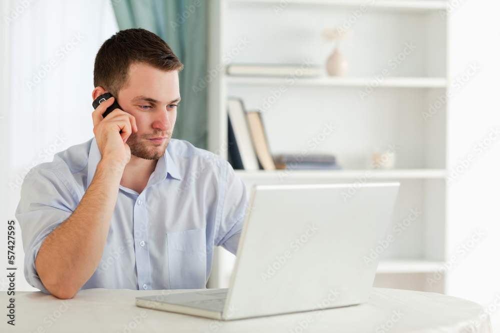 Businessman in his homeoffice calling Businessman in his homeoffice calling