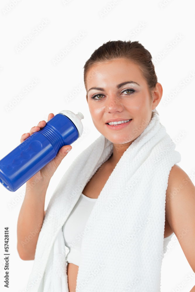 Smiling woman with her bottle after workout Smiling woman with her bottle after workout
