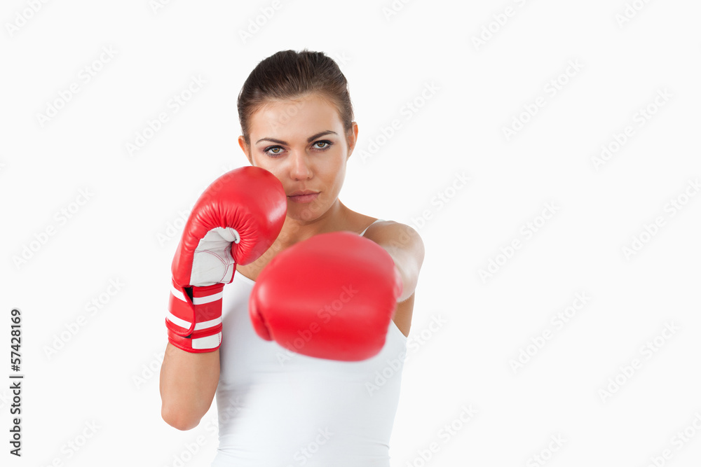 Young female boxer attacking with her left Young female boxer attacking with her left