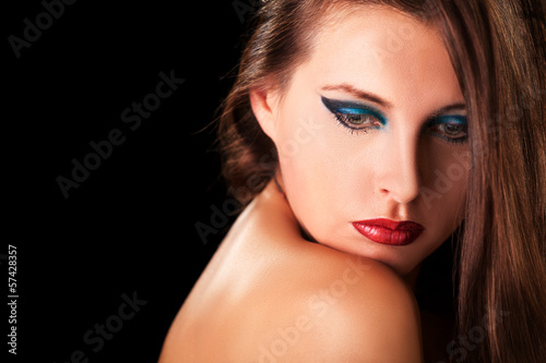 Sensual woman with professional makeup on black background