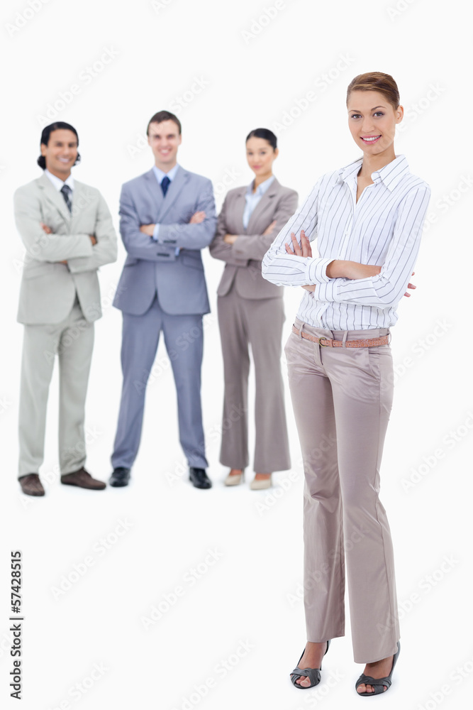 Fototapeta premium Secretary smiling and crossing her arms with happy business peop