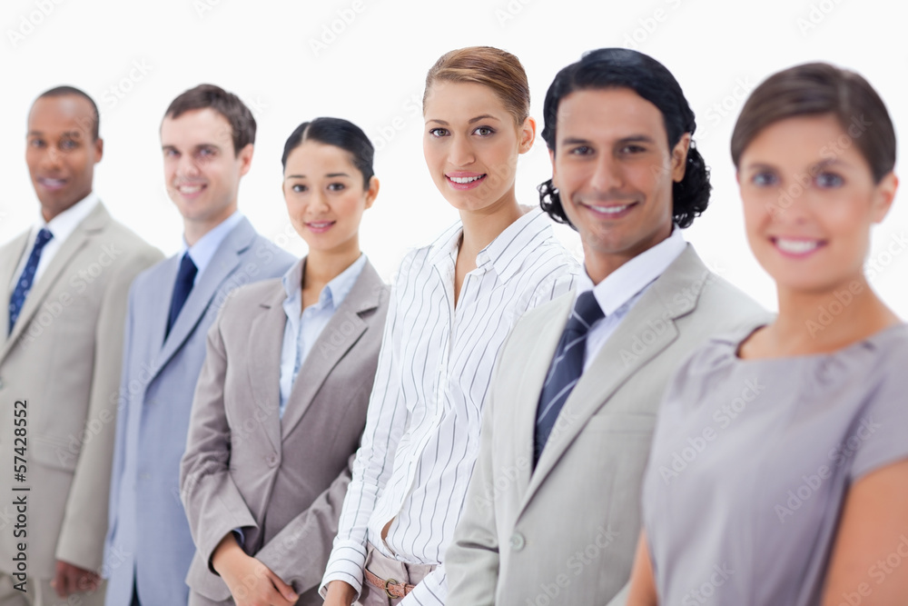 Close-up of smiling business people looking straight Close-up of smiling business people looking straight