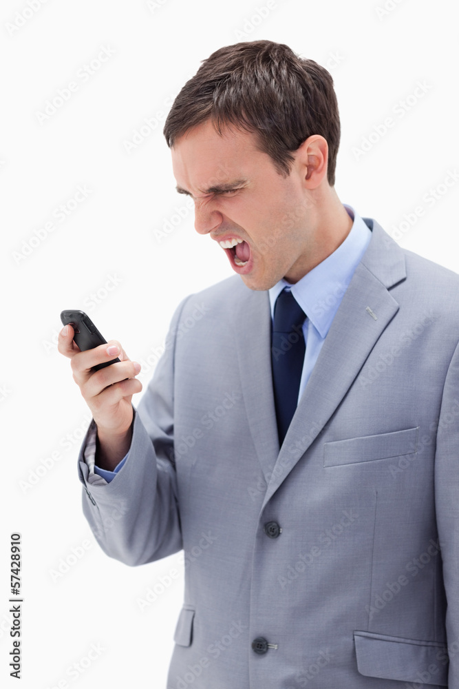 Businessman yelling at his cellphone Businessman yelling at his cellphone