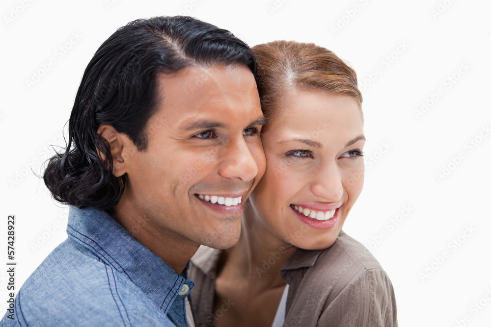 Side view of close together standing couple Side view of close together standing couple