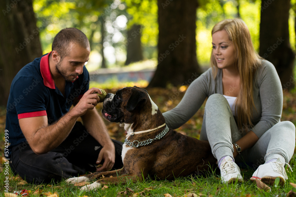 Smiling Couple And Her Dog