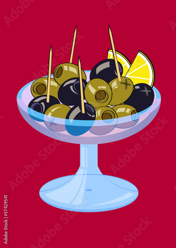 Green and black olives with lemon wedges in a vase