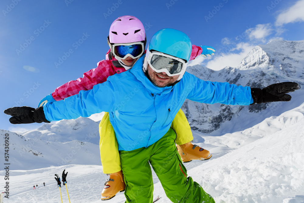 Ski, winter, sun and fun - family enjoying winter