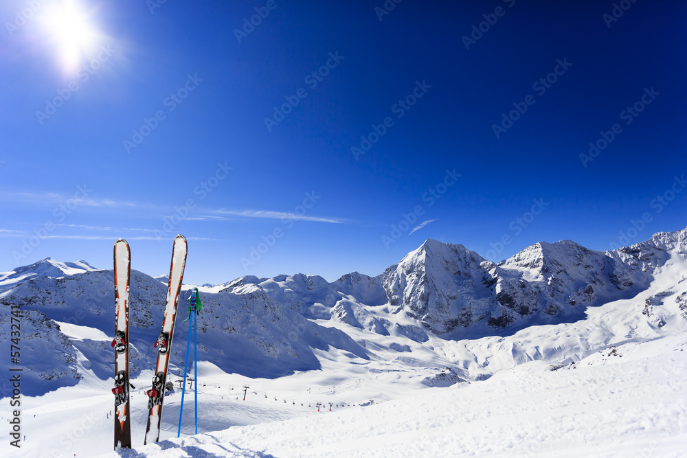 Skiing, mountains and ski equipments on ski run