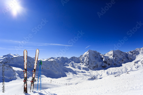 Skiing, mountains and ski equipments on ski run