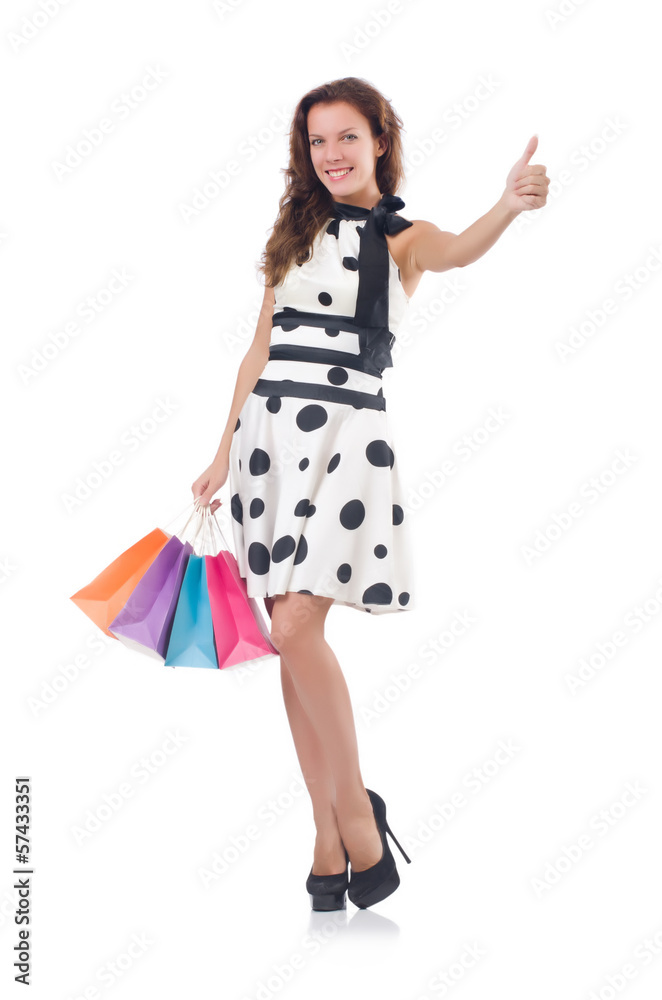 Fototapeta premium Girl after good shopping on white