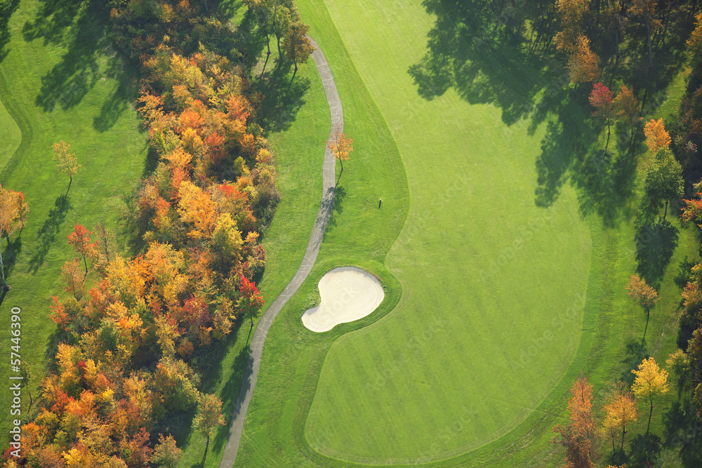 Fototapeta premium Aerial view of golf course during autumn