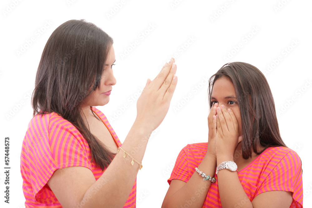 mother preparing to slap her daughter in the face