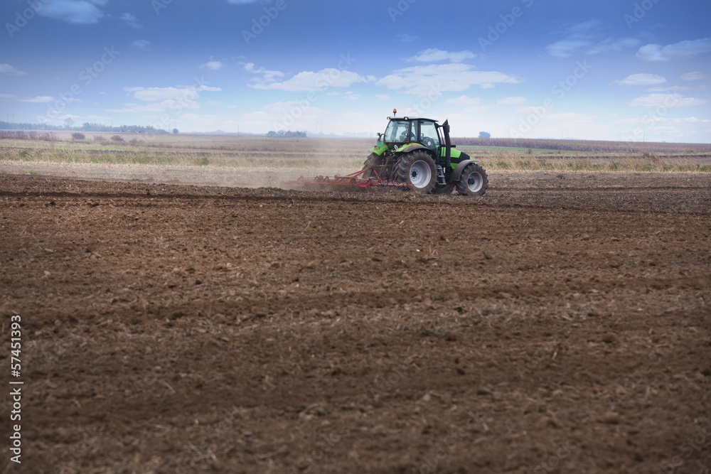 Tractor preparing land for autumn sowing of wheat Tractor preparing land for autumn sowing of wheat