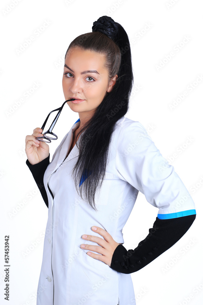 A portrait of a sexy beautiful female brunette doctor in a white A portrait of a sexy beautiful female brunette doctor in a white