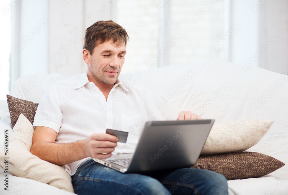 man with laptop and credit card at home man with laptop and credit card at home