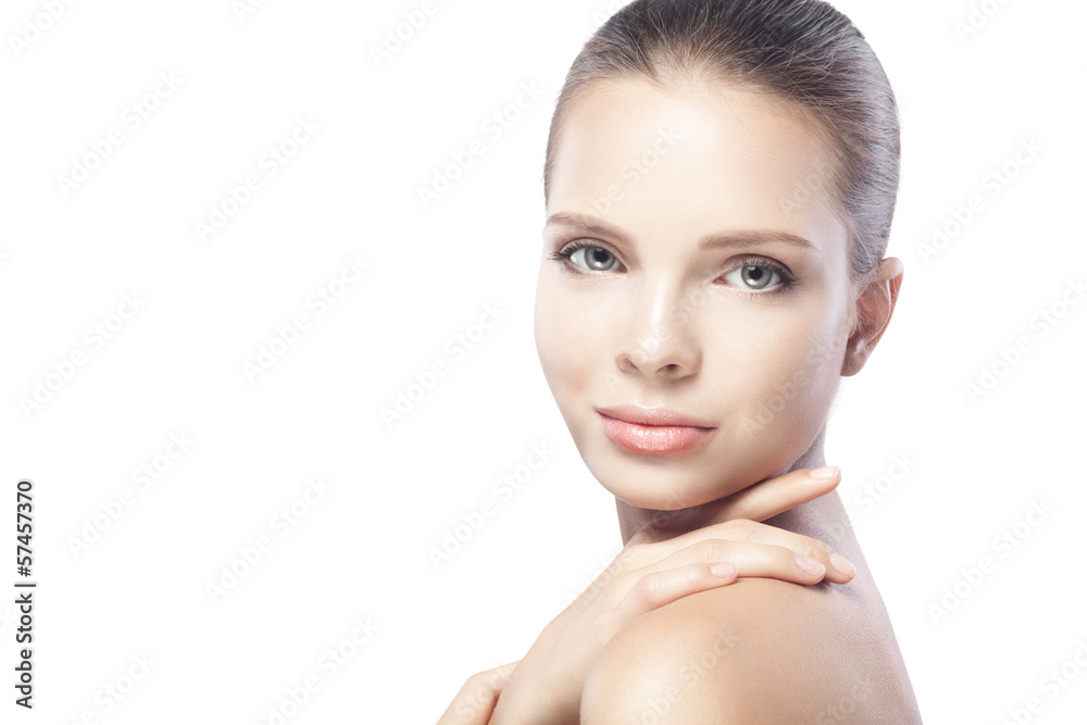 Naklejka premium portrait of beautiful young woman with clean skin isolated on wh
