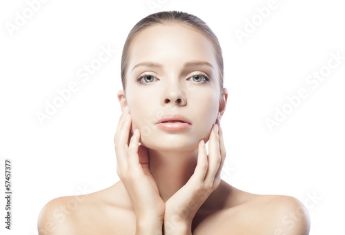 portrait of beautiful young woman with clean skin isolated on wh