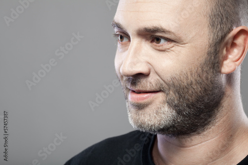 man looking to the left isolated on gray background with copyspa photo