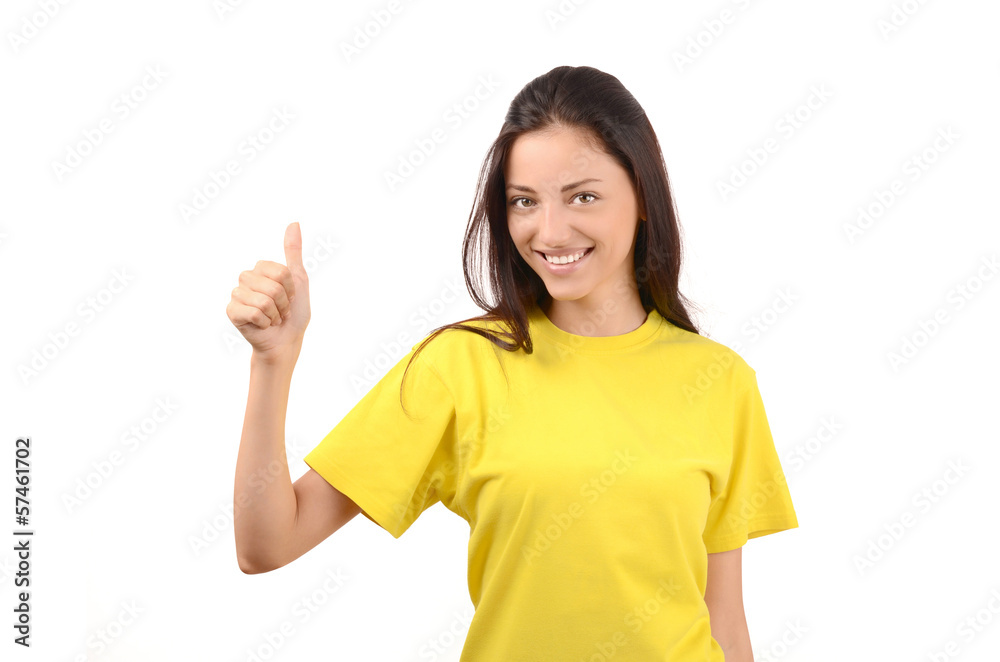 Happy girl with yellow t-shirt signing thumbs up.