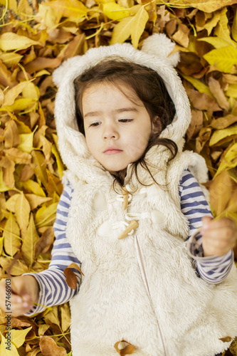 Little girl at the autumn l...