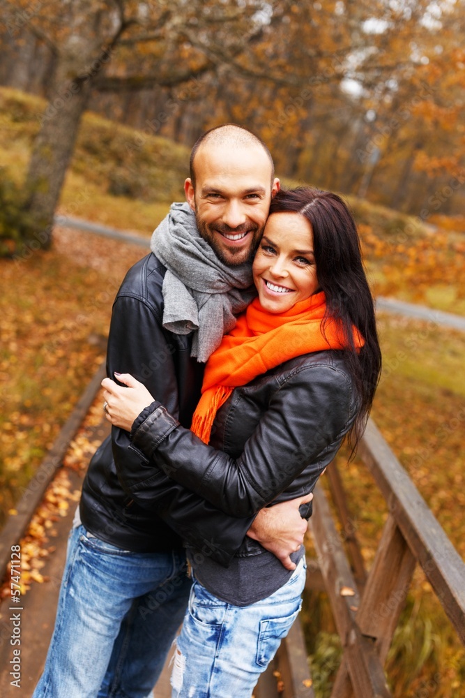 Fototapeta premium Happy middle-aged couple outdoors on beautiful autumn day