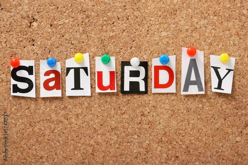 The word Saturday on a cork notice board